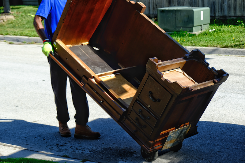 A hand truck or dolly can significantly reduce the physical effort required to move a heavy piece of furniture